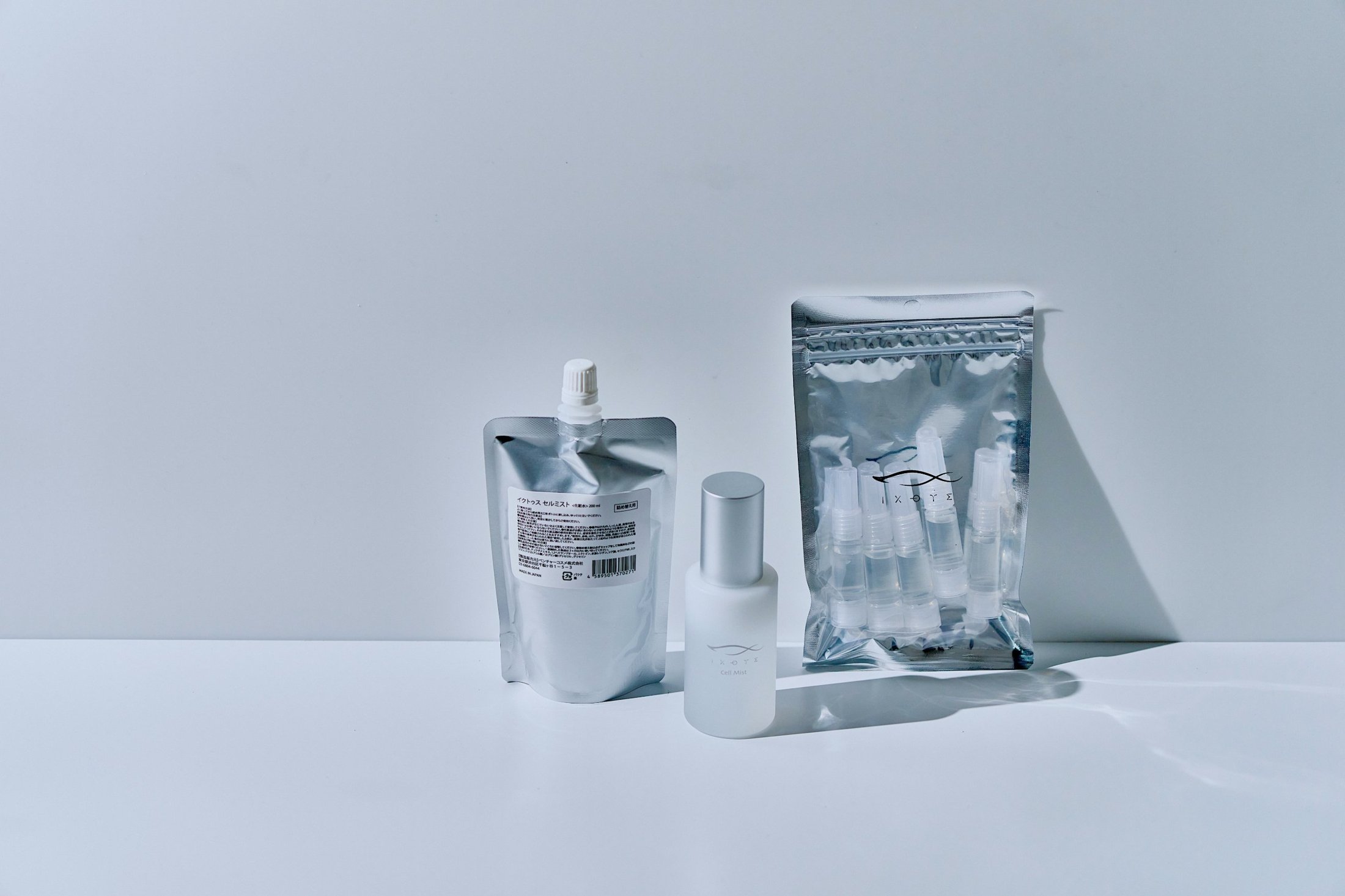 The ICHTHYS line-up: Cell Mist bottle, Cell Mist refill pouch and Skin Serum vials